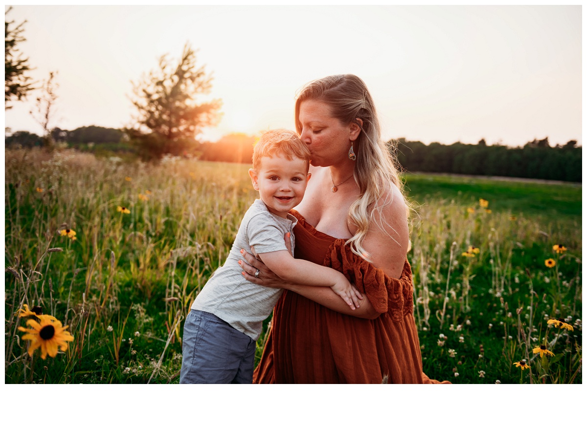 maternity mom and toddler photo in a field