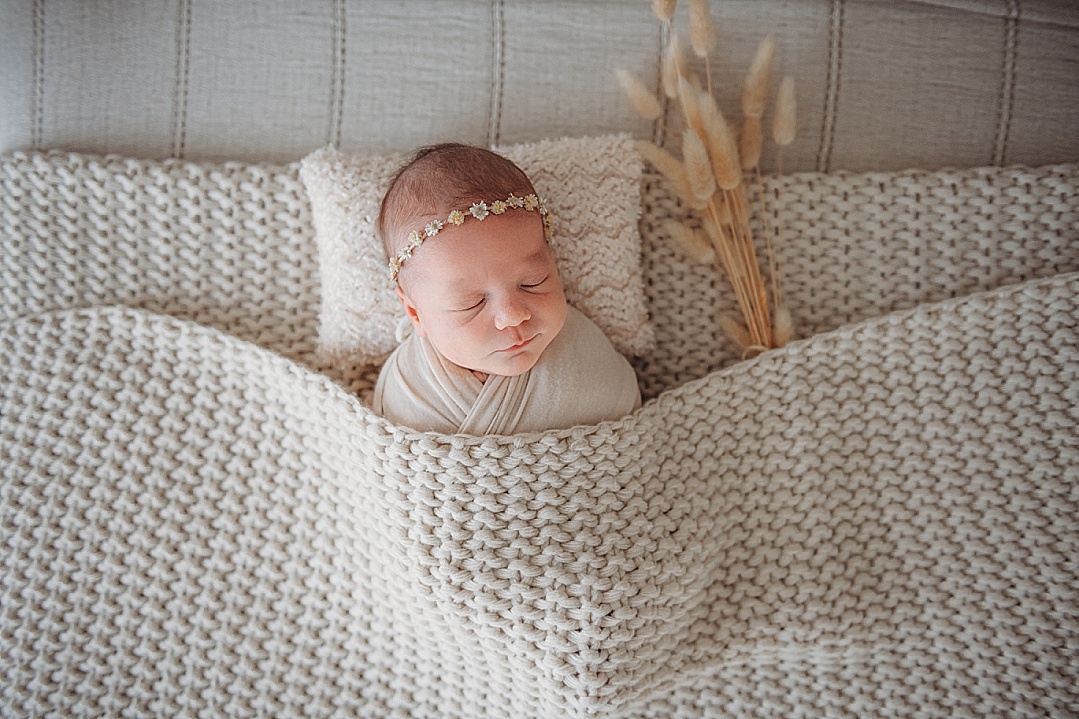 boho baby in knit blanket in Kent Island newborn photography session