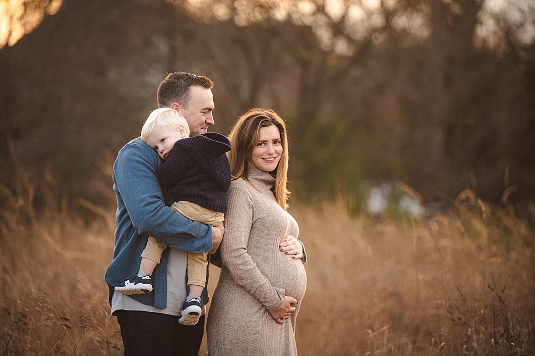 maternity session in Annapolis field with little boy
