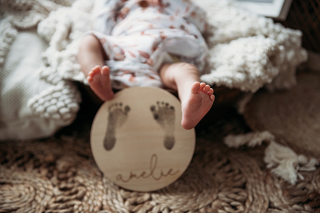 newborn baby girl toes with foot print for Annapolis newborn photography session